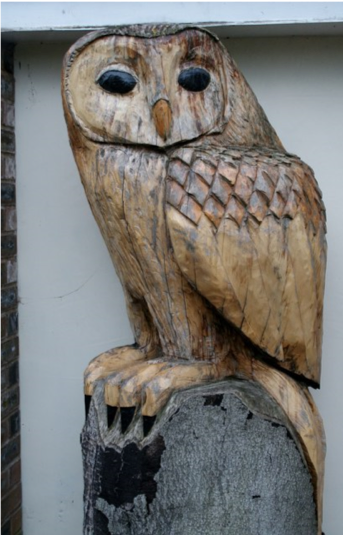 wooden sculpture of owl